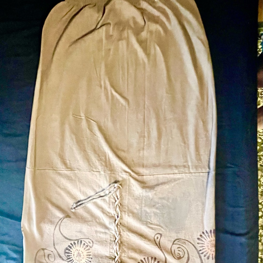 Make me an offer 😊 
Blue Fish Tan Maxi Skirt with Floral Design.